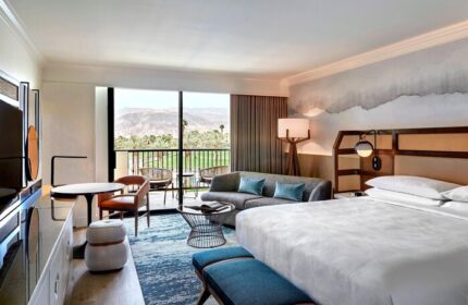JW Marriott Desert Springs Resort & Spa guest room. Balcony view, modern decor. Gay-friendly hotel for discerning travelers.