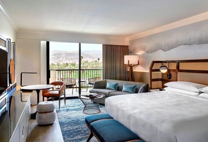 JW Marriott Desert Springs Resort & Spa guest room. Balcony view, modern decor. Gay-friendly hotel for discerning travelers.