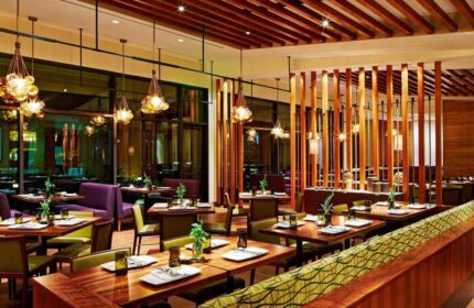 JW Marriott Desert Springs Resort & Spa's restaurant interior. Tables are set, ready for diners at this gay-friendly hotel.