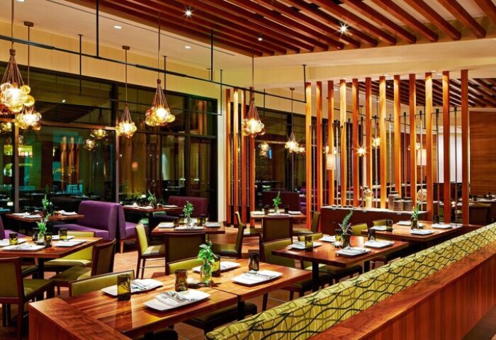 JW Marriott Desert Springs Resort & Spa's restaurant interior. Tables are set, ready for diners at this gay-friendly hotel.