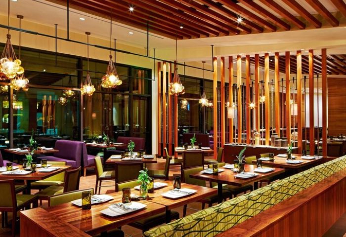 JW Marriott Desert Springs Resort & Spa's restaurant interior. Tables are set, ready for diners at this gay-friendly hotel.