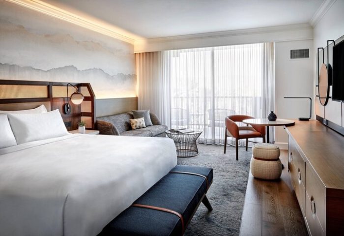 JW Marriott Desert Springs Resort & Spa gay-friendly hotel room. King bed, seating area, and balcony view. Luxury travel for gay men.