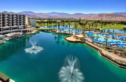 JW Marriott Desert Springs Resort & Spa view. Gay-friendly hotel with pools, fountains, palm trees, and mountains. Ideal for gay travel.