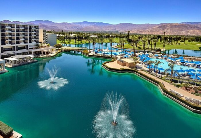 JW Marriott Desert Springs Resort & Spa view. Gay-friendly hotel with pools, fountains, palm trees, and mountains. Ideal for gay travel.