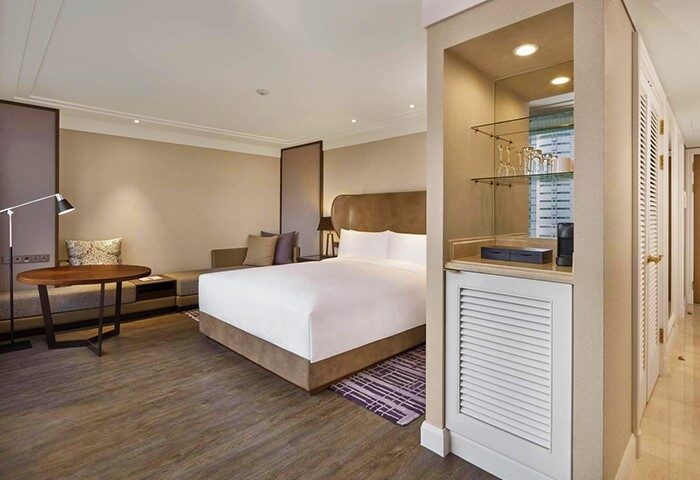 JW Marriott Hotel Seoul: A gay-friendly hotel room. Features a king bed, sitting area, and minibar. Modern design for gay travelers.