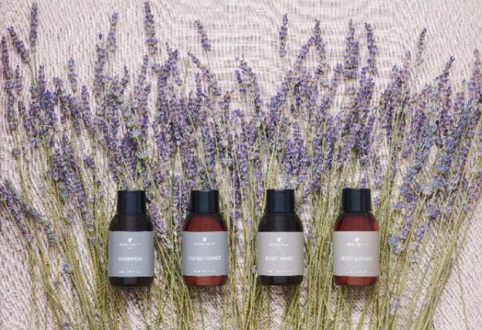 JW Marriott Hotel Seoul gay-friendly amenities: Shampoo, conditioner, body wash, and lotion bottles displayed with lavender sprigs.