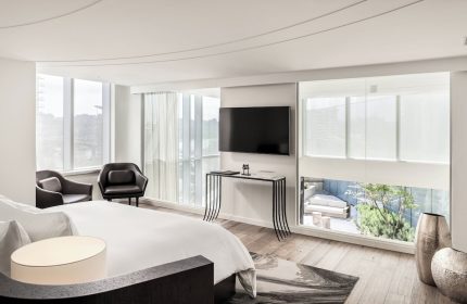 JW Marriott Parq Vancouver gay-friendly hotel room. Modern design, large windows, and city views. Ideal for gay travelers seeking luxury.