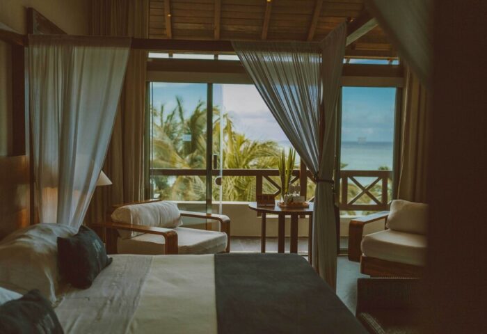Jashita Hotel gay-friendly suite with ocean view. Luxury room with balcony, ideal for gay travelers seeking a relaxing getaway.