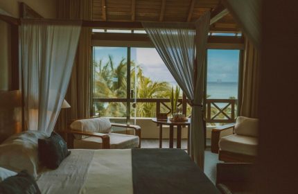 Jashita Hotel gay-friendly suite with ocean view. Luxury room with balcony, ideal for gay travelers seeking a relaxing getaway.