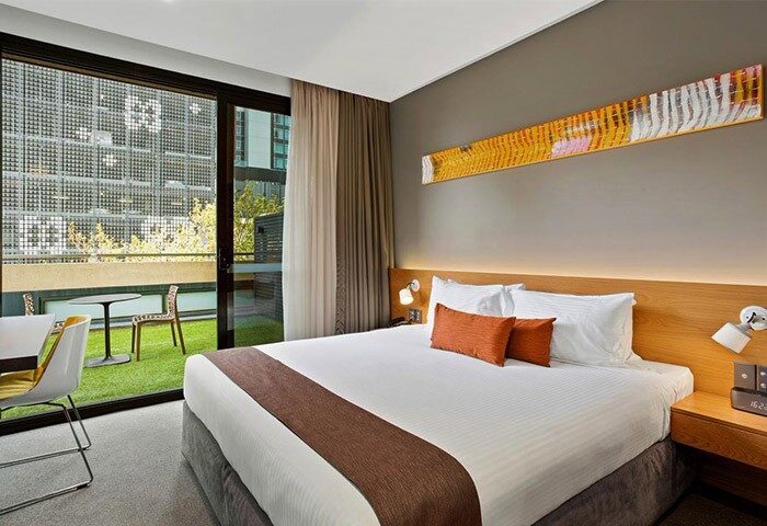 Jasper Boutique Hotel's gay-friendly room with a balcony. Modern design, comfy bed, and outdoor seating. Ideal for gay travel.