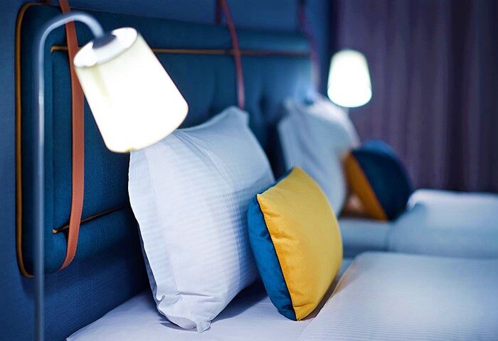 Just Sleep Hotel Ximending room. Gay-friendly hotel with comfy beds, pillows, and stylish lamps. A great choice for gay travelers in Taipei.