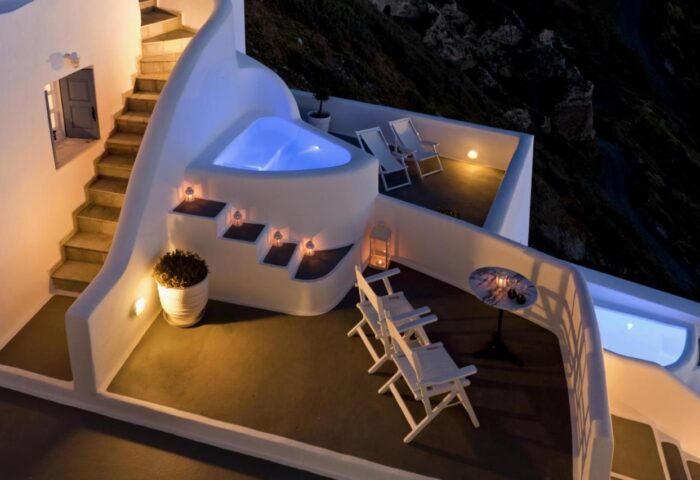 Kamares Apartments: Gay-friendly hotel with a jacuzzi. White architecture, stairs, and lounge chairs create a relaxing vacation vibe.