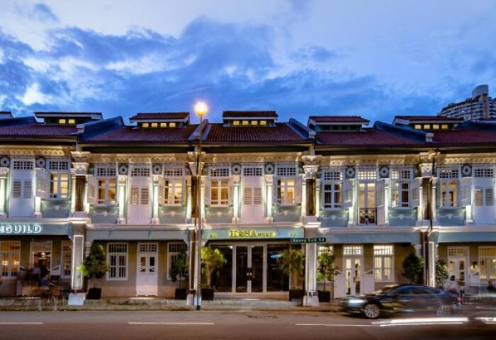 KēSa House, The Unlimited Collection by Oakwood, a gay-friendly hotel. Exterior view of the Singapore hotel at dusk. Gay travel advice.