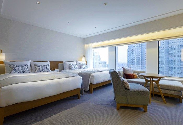 Keio Plaza Hotel Tokyo's gay-friendly room. Two beds, a sofa, and a table offer comfort. Enjoy city views from this top Tokyo hotel.