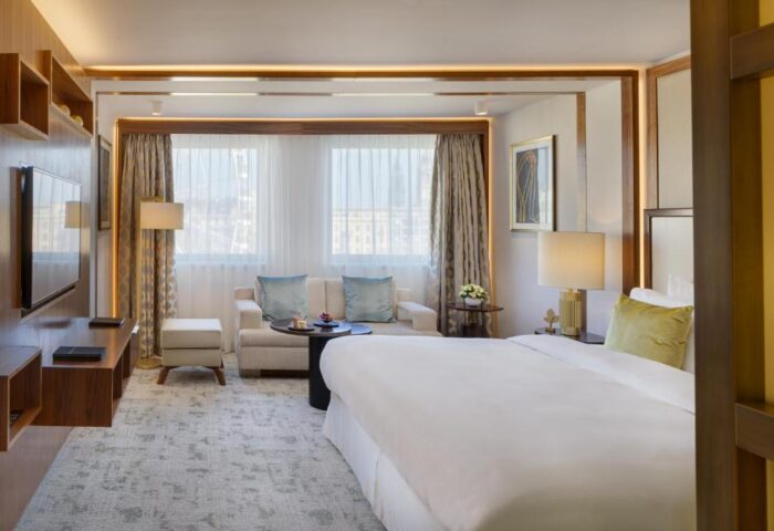 Kempinski Hotel Corvinus Budapest room. This gay-friendly, pet-friendly hotel offers luxury accommodations. Comfy bed and sitting area.