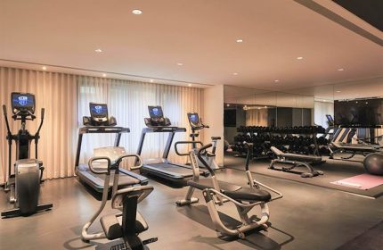 Kimpton Da An Hotel's gym. Treadmills, elliptical, and weights offer a complete workout. A gay-friendly hotel with fitness options.