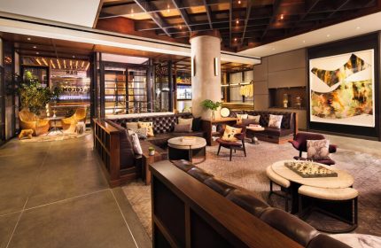 Kimpton Hotel Eventi's stylish lounge. This gay-friendly hotel features modern decor, leather seating, and a welcoming atmosphere for gay men travelers.