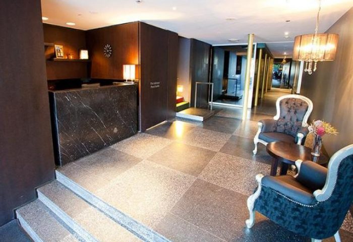 Kirketon Hotel Sydney lobby. Modern, gay-friendly hotel with stylish decor, chairs, and lighting. A great choice for gay men travel in Sydney.