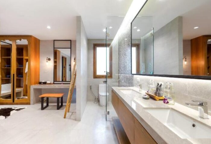 Krabi Resort Pool Villa bathroom. Gay-friendly hotel with modern design, double sinks, and ample storage. A luxurious space for a relaxing getaway.