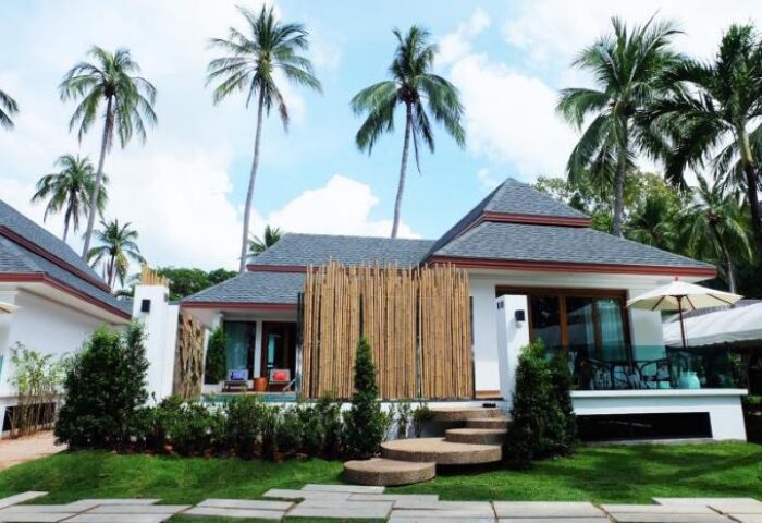 Krabi Resort Pool Villa: Gay-friendly hotel. Exterior view of a villa with a private pool, palm trees, and tropical landscaping.