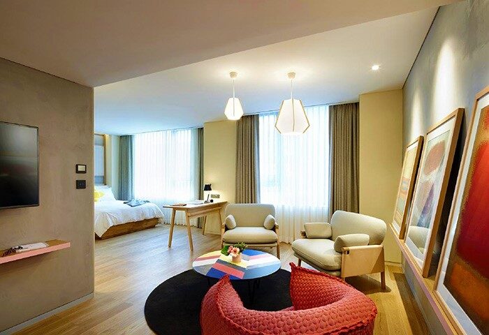 L7 Myeongdong by LOTTE hotel room. Gay-friendly travel. Modern design, colorful accents, inviting space. Perfect for LGBT travelers.