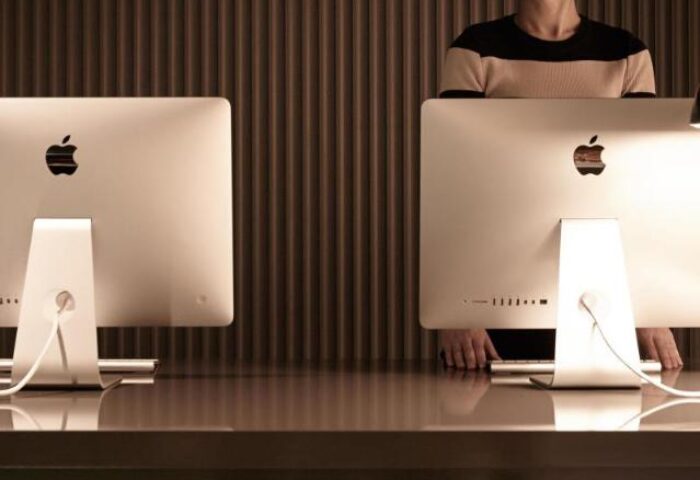 L7 Myeongdong by LOTTE reception desk with Apple computers. Gay-friendly hotel in Seoul, South Korea. Great for gay men travel, modern design.