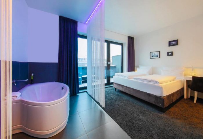 Lindemann's Hotel room. Gay-friendly hotel with bathtub, bed, and balcony. Modern design, perfect for gay travel. Berlin hotel room.