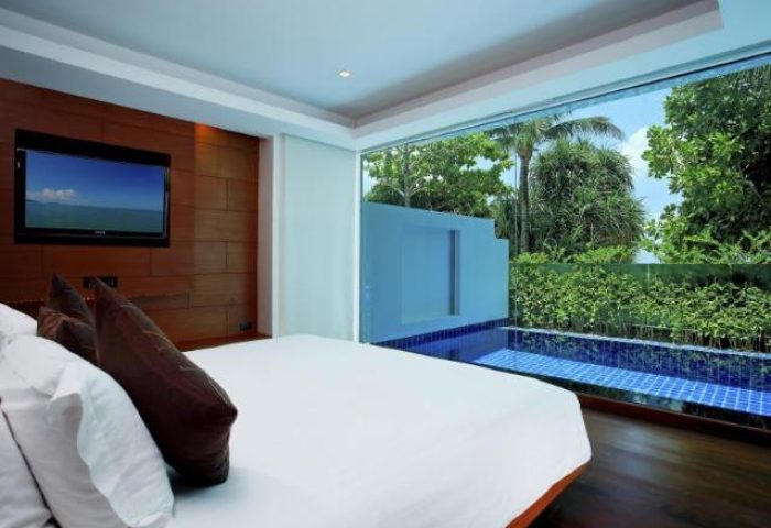 La Flora Resort Patong gay-friendly hotel room with pool view. Modern design, inviting for gay travelers seeking luxury in Thailand.