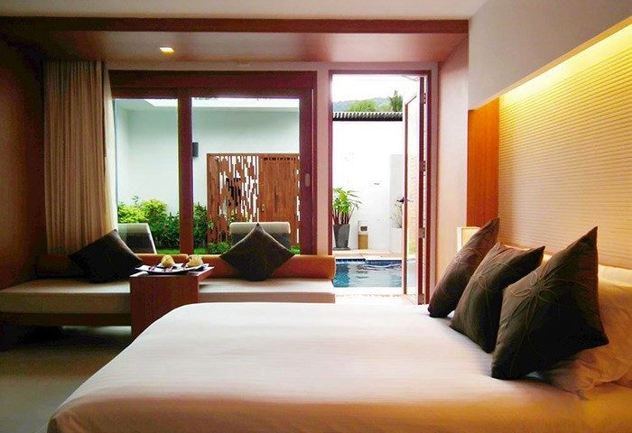 La Flora Resort Patong gay-friendly hotel room. Pool access, comfy bed, and modern design. Perfect for gay travel in Patong, Thailand.