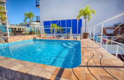 La Iguana Vallarta LGBT adults-only hotel pool in Romantic Zone. Party & clubbing street view. Gay-friendly travel in Puerto Vallarta.