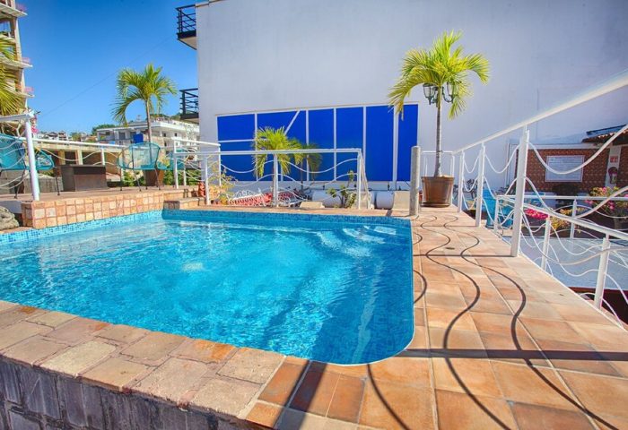 La Iguana Vallarta LGBT adults-only hotel pool in Romantic Zone. Party & clubbing street view. Gay-friendly travel in Puerto Vallarta.