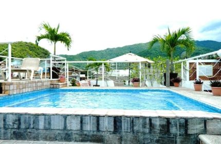 La Iguana Vallarta LGBT adults-only hotel pool. Romantic Zone party clubbing street view. Gay-friendly vacation in Puerto Vallarta.
