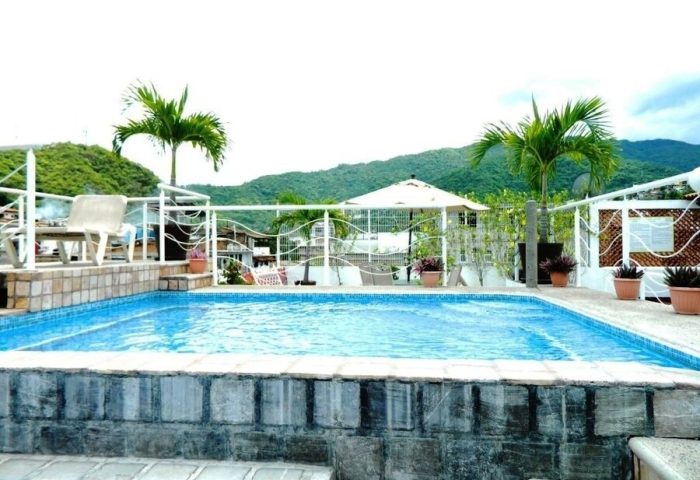 La Iguana Vallarta LGBT adults-only hotel pool. Romantic Zone party clubbing street view. Gay-friendly vacation in Puerto Vallarta.