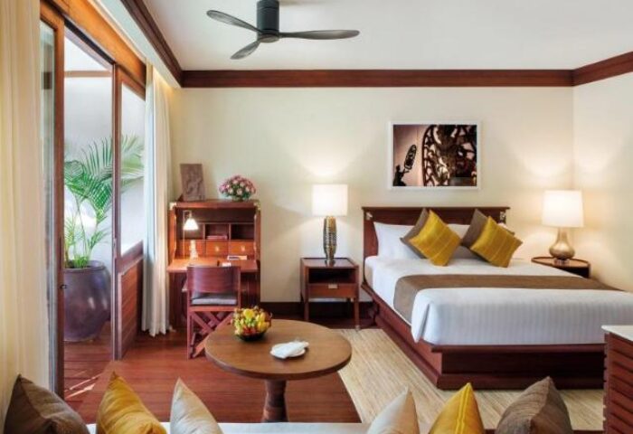 La Residence d'Angkor, a Belmond Hotel, Siem Reap room. Gay-friendly hotel with desk, bed, & balcony. Perfect for gay travel.