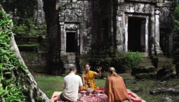 La Residence d'Angkor, a Belmond Hotel, Siem Reap: Monk blessing at ancient temple. Gay-friendly hotel experience in Cambodia.