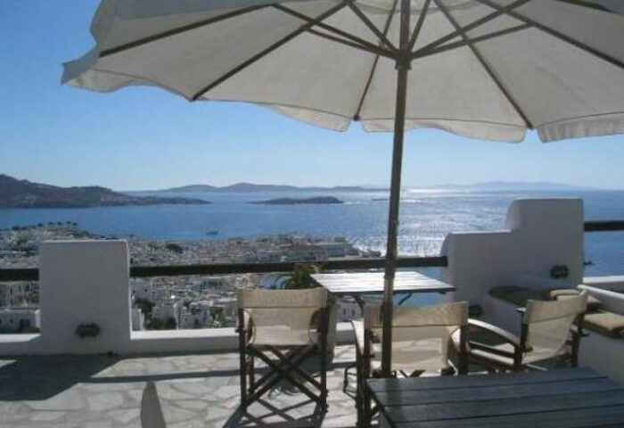 La Veranda of Mykonos Traditional Guesthouse view. Gay-friendly hotel terrace overlooking the Aegean Sea. Mykonos gay travel advice.