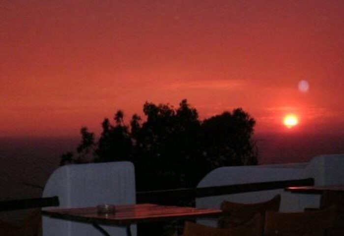 Sunset view from La Veranda of Mykonos Traditional Guesthouse. Gay-friendly hotel with scenic views for gay men travelers.