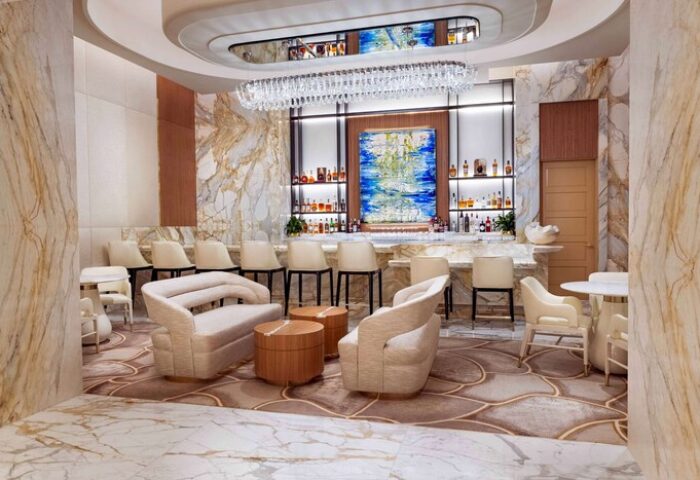 Las Vegas Hilton at Resorts World gay-friendly hotel bar. Upscale lounge with marble, chandelier, & seating. Great for gay men travelers.