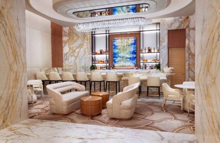 Las Vegas Hilton at Resorts World gay-friendly hotel bar. Upscale lounge with marble, chandelier, & seating. Great for gay men travelers.