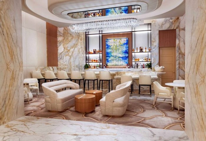 Las Vegas Hilton at Resorts World gay-friendly hotel bar. Upscale lounge with marble, chandelier, & seating. Great for gay men travelers.