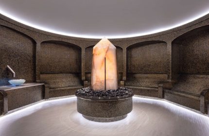 Las Vegas Hilton at Resorts World spa. Gay-friendly hotel features a salt crystal centerpiece, mosaic walls, & relaxing seating. Luxury travel.
