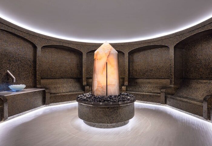 Las Vegas Hilton at Resorts World spa. Gay-friendly hotel features a salt crystal centerpiece, mosaic walls, & relaxing seating. Luxury travel.