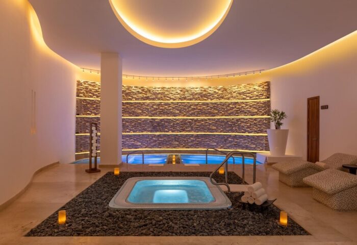 Le Blanc Resort Cancun Adults Only All-Inclusive gay-friendly hotel spa. Jacuzzi, pools, and relaxation area in luxury setting.