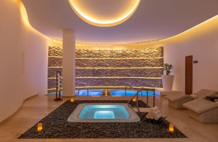 Le Blanc Resort Cancun Adults Only All-Inclusive gay-friendly hotel spa. Jacuzzi, pools, and relaxation area in luxury setting.