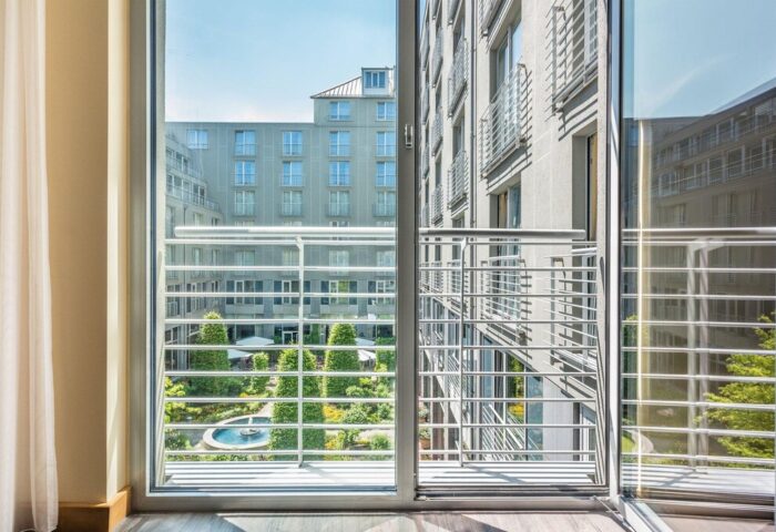 View from Le Méridien Munich, a gay-friendly hotel. Balcony overlooks a courtyard with a fountain. Ideal for gay travelers in Munich.