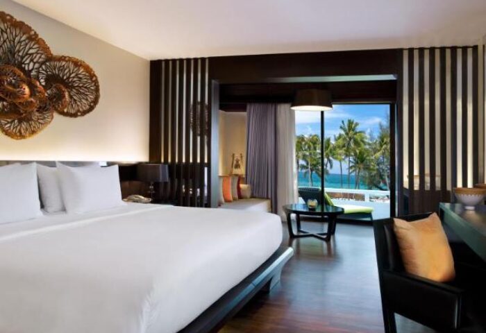 Le Meridien Phuket Beach Resort SHA Certified room. Gay-friendly hotel with sea view from the balcony. Perfect for gay travel in Phuket.