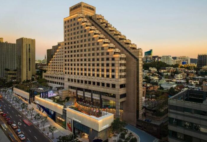 Le Meridien Seoul hotel exterior view. Gay-friendly hotel in Seoul, South Korea. Modern architecture with city skyline backdrop.