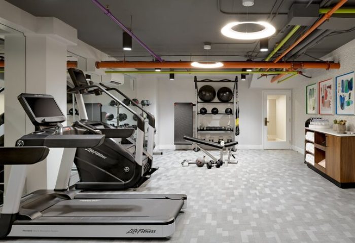 Le Parc at Melrose gym with treadmill, weights, and exercise equipment. Gay-friendly hotel fitness center for gay men's travel.
