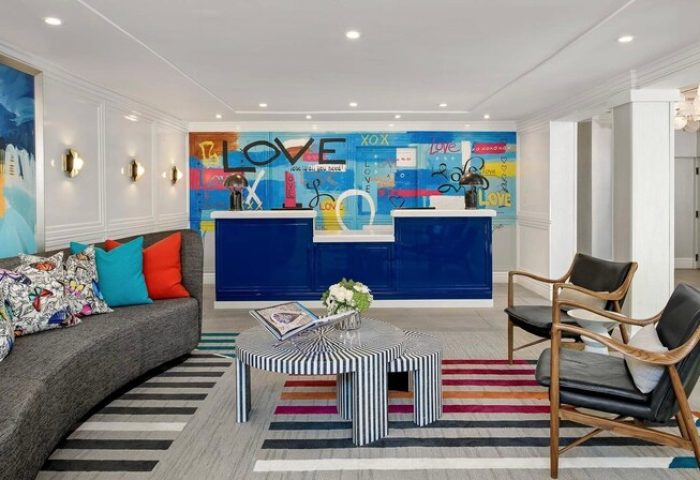 Le Parc at Melrose lobby. Gay-friendly hotel reception area with modern design, colorful art, and stylish furniture. Melrose gay travel.