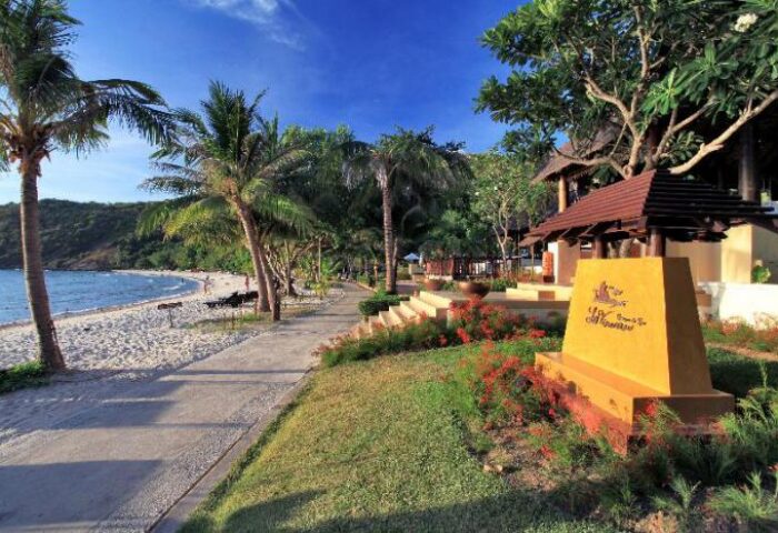 Le Vimarn Cottages & Spa: Beachfront view at this gay-friendly hotel. Tropical paradise with palm trees, sandy beach, and inviting cottages.
